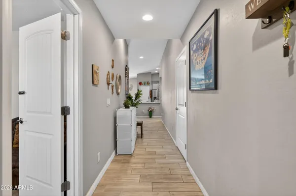 a living room with furniture and flowers