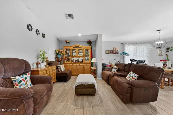 a kitchen with sink cabinets and wooden floor
