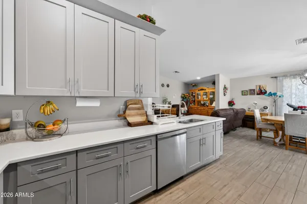 a kitchen with stainless steel appliances a refrigerator and cabinets