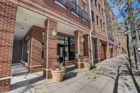 a view of a building with sitting area