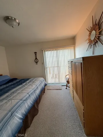 a bed room with a bed and a television