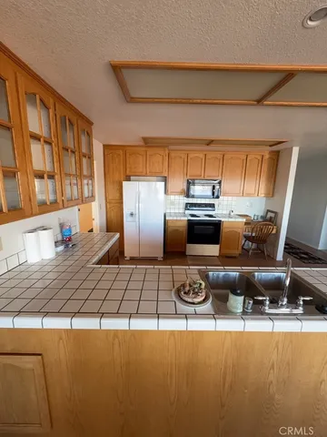 a kitchen with a stove and a refrigerator