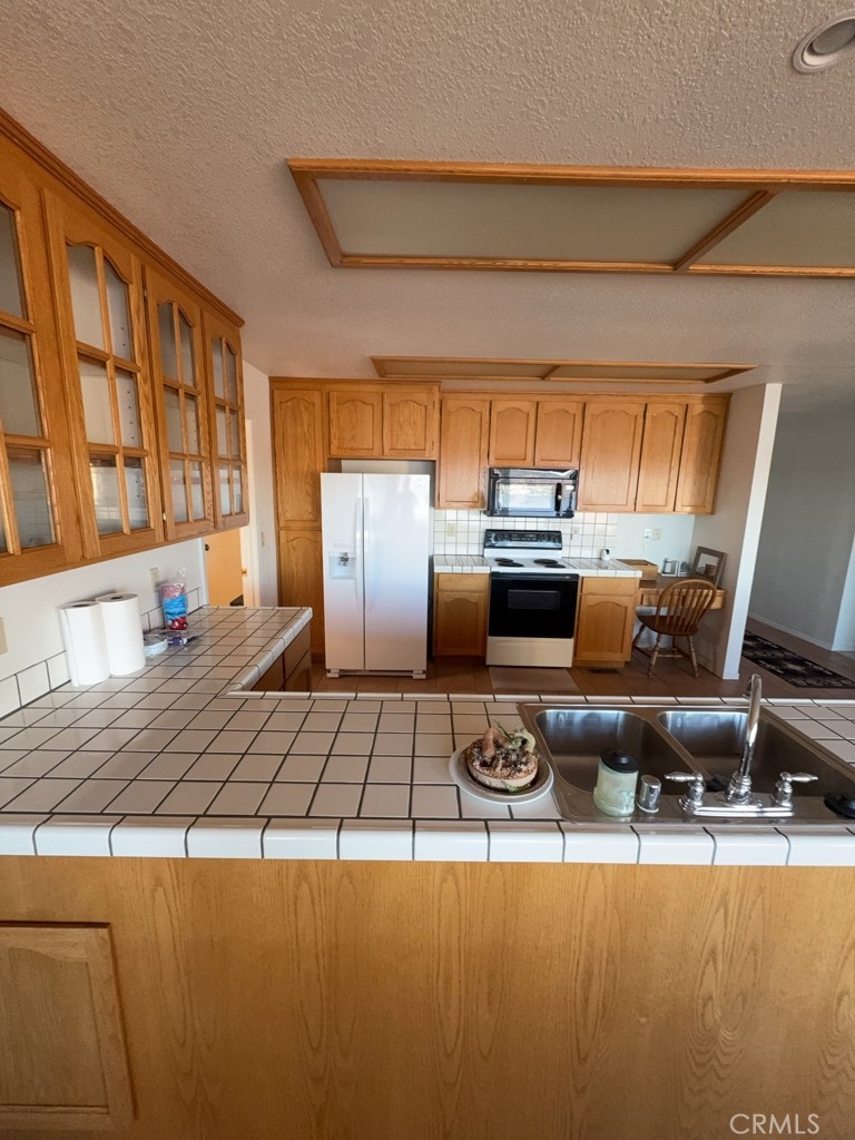4816 Marina Drive Kelseyville, CA 95451 - Photo 17 of 28 a kitchen with a stove and a refrigerator