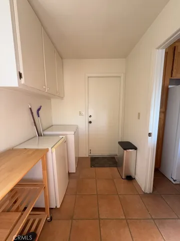 a kitchen with a sink and a refrigerator