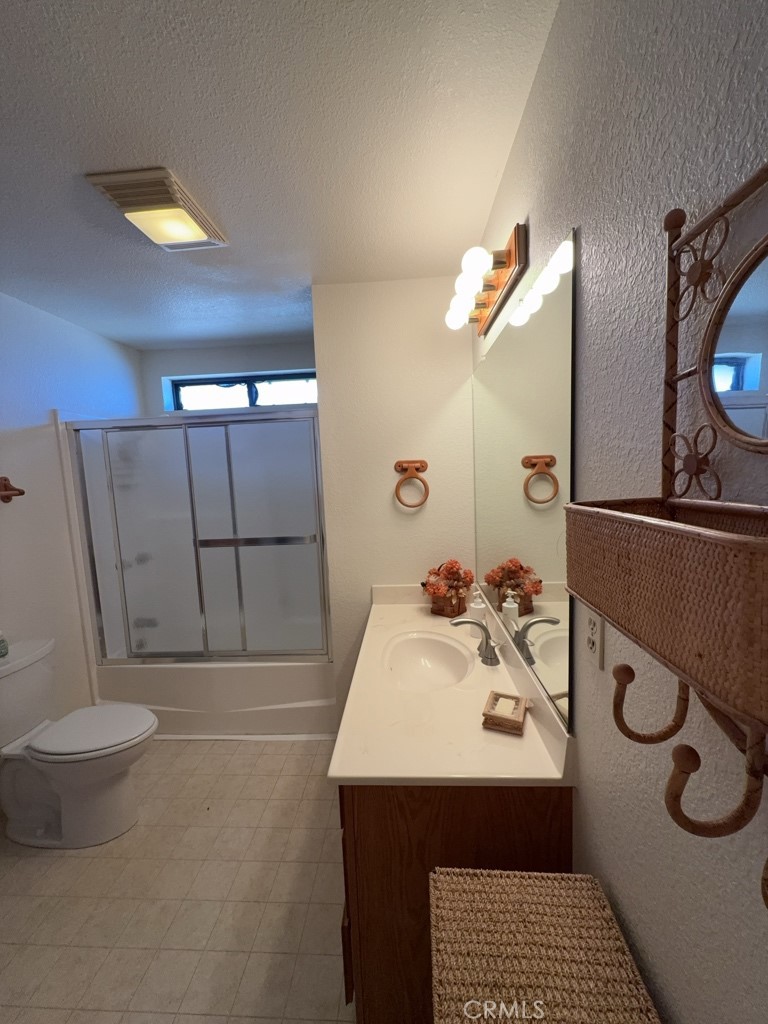 4816 Marina Drive Kelseyville, CA 95451 - Photo 25 of 28 a bathroom with a sink and a mirror