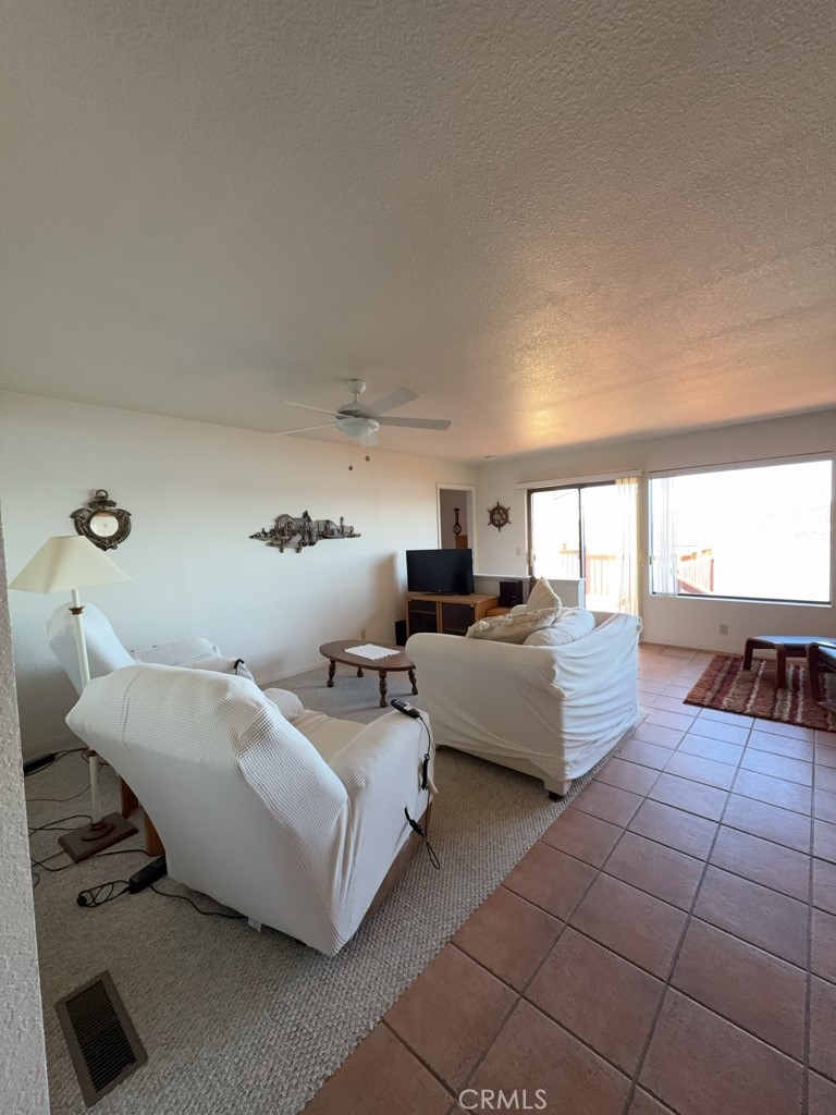 4816 Marina Drive Kelseyville, CA 95451 - Photo 5 of 28 a living room with furniture and a large window