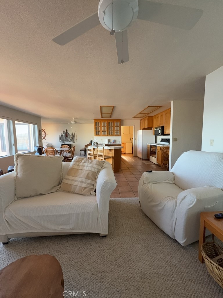 4816 Marina Drive Kelseyville, CA 95451 - Photo 6 of 28 a living room with furniture and a chandelier