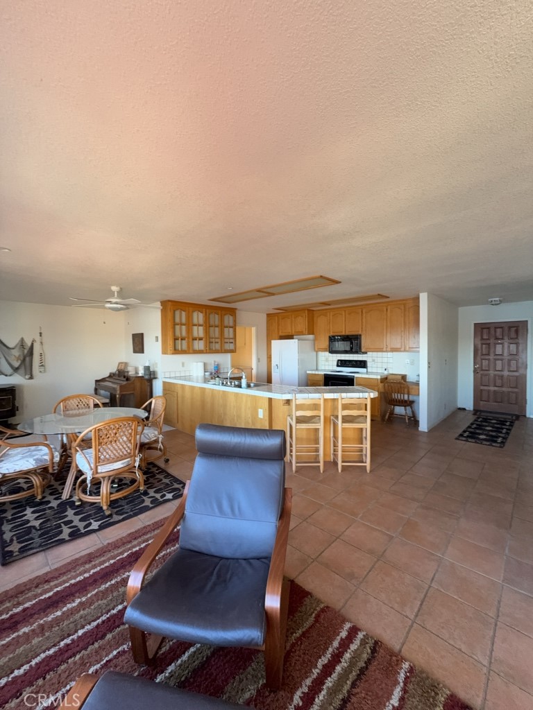 4816 Marina Drive Kelseyville, CA 95451 - Photo 8 of 28 a living room with furniture a flat screen tv and kitchen view