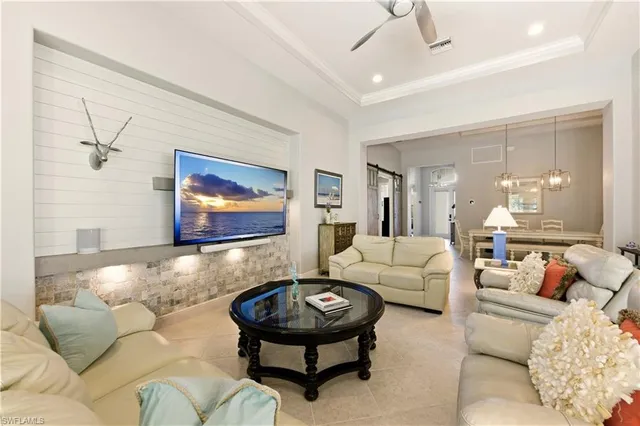 a bedroom with furniture and a flat screen tv