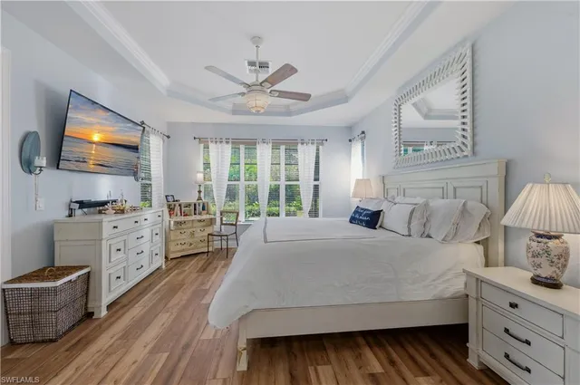 a bathroom with a granite countertop sink a toilet and a shower curtain