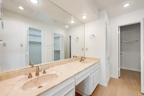a bathroom with a sink double vanity and a mirror