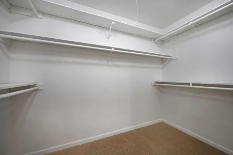 a view of an empty walk in closet