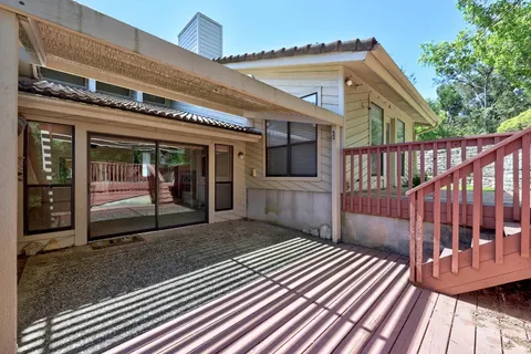 a view of a porch with wooden floor