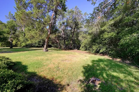 a view of outdoor space with deck and yard