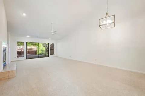 an empty room with windows and view