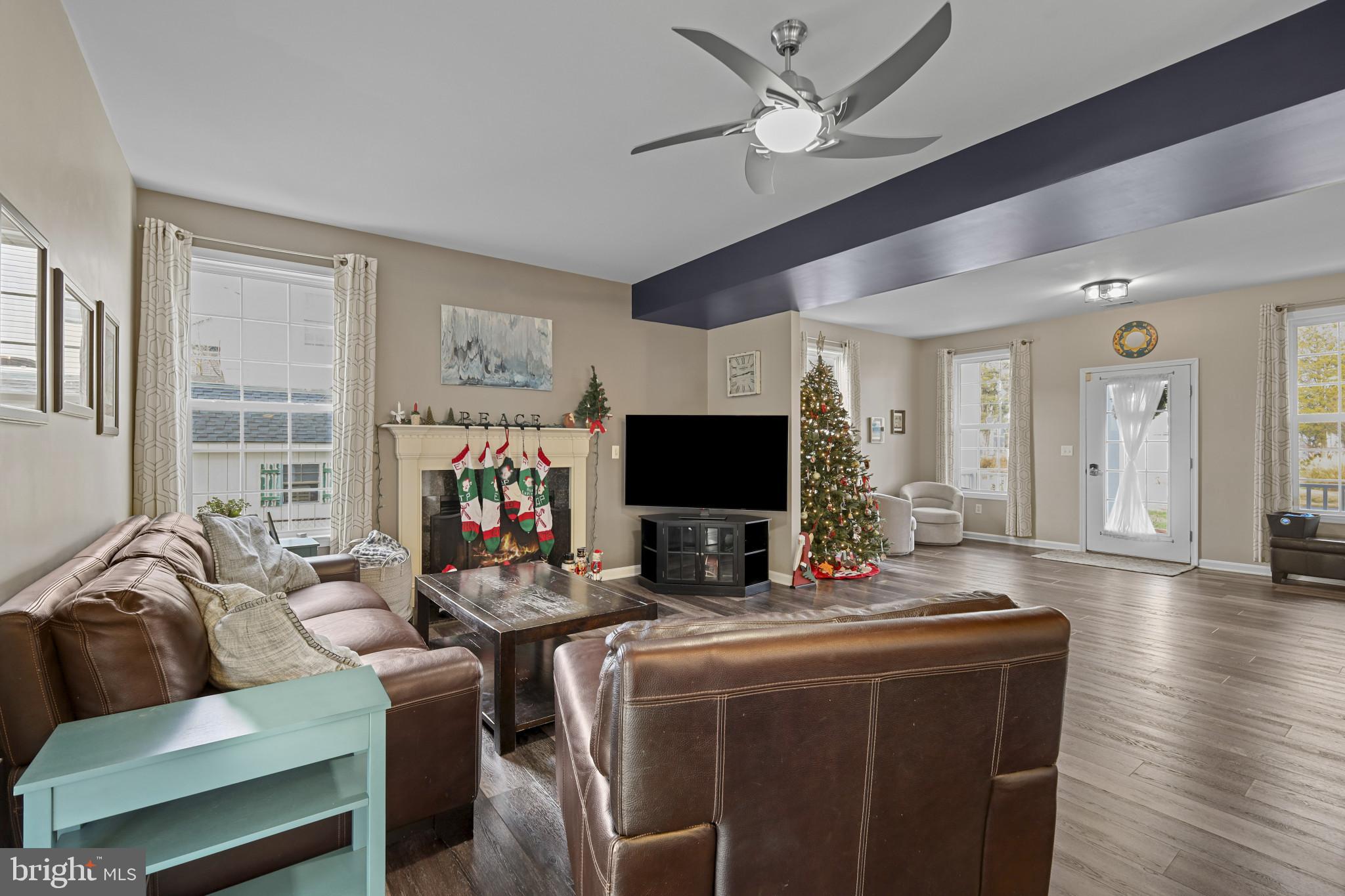 4220 Kings Road Edgewater, MD 21037 - Photo 16 of 78 a living room with furniture a flat screen tv and a large window