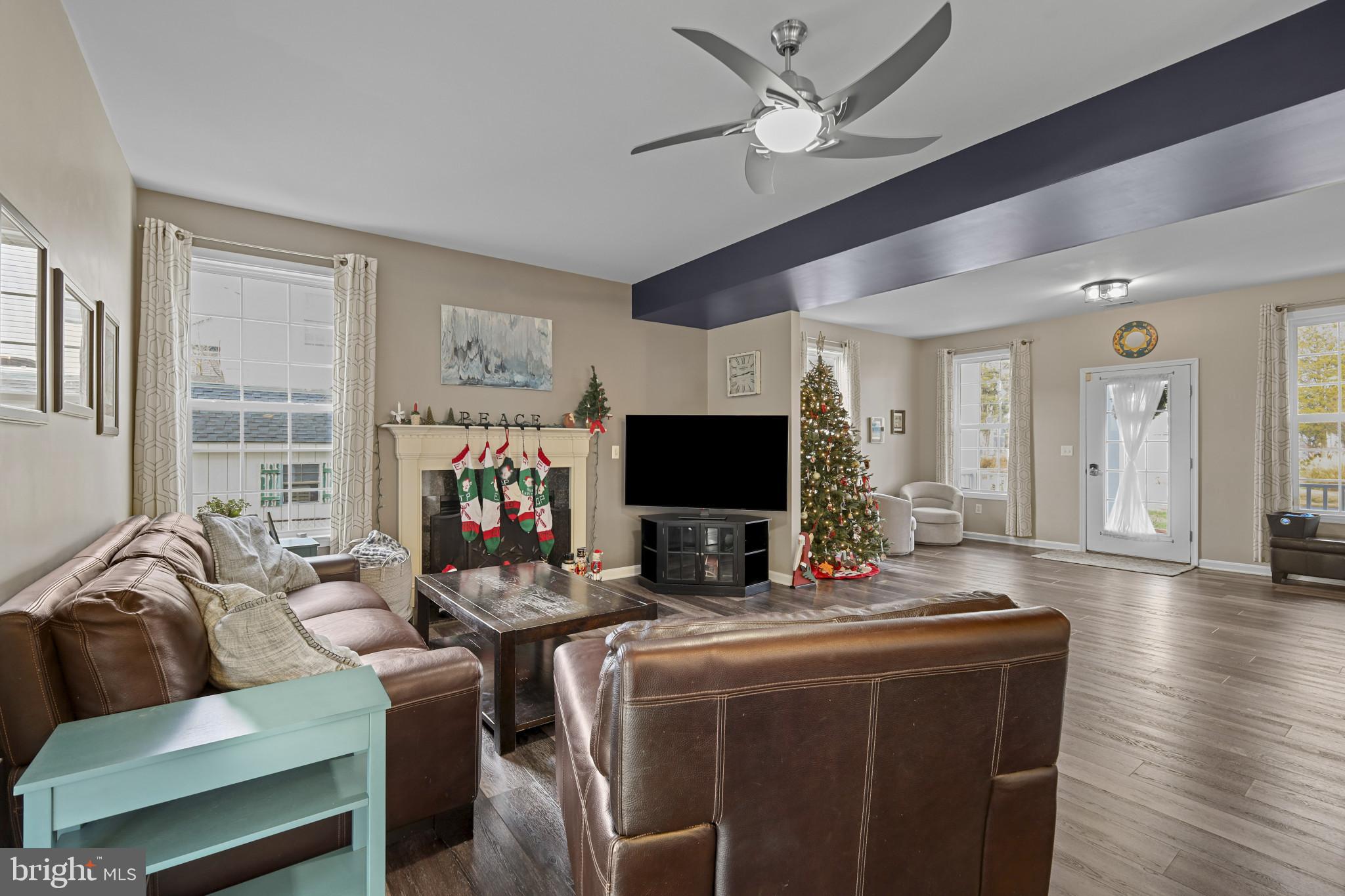 4220 Kings Road Edgewater, MD 21037 - Photo 17 of 78 a living room with furniture a flat screen tv and a large window
