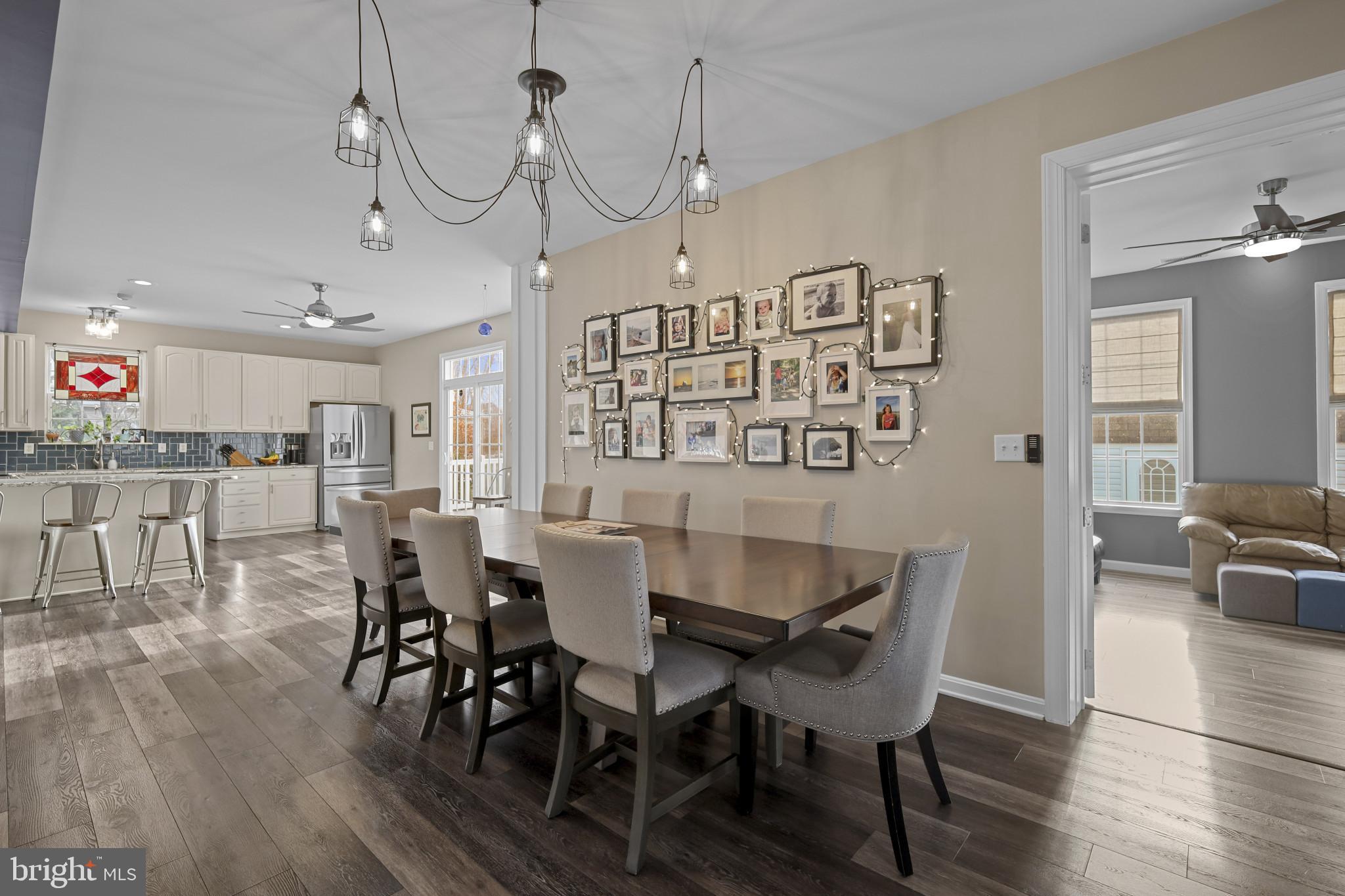 4220 Kings Road Edgewater, MD 21037 - Photo 18 of 78 a view of a dining room with furniture and wooden floor