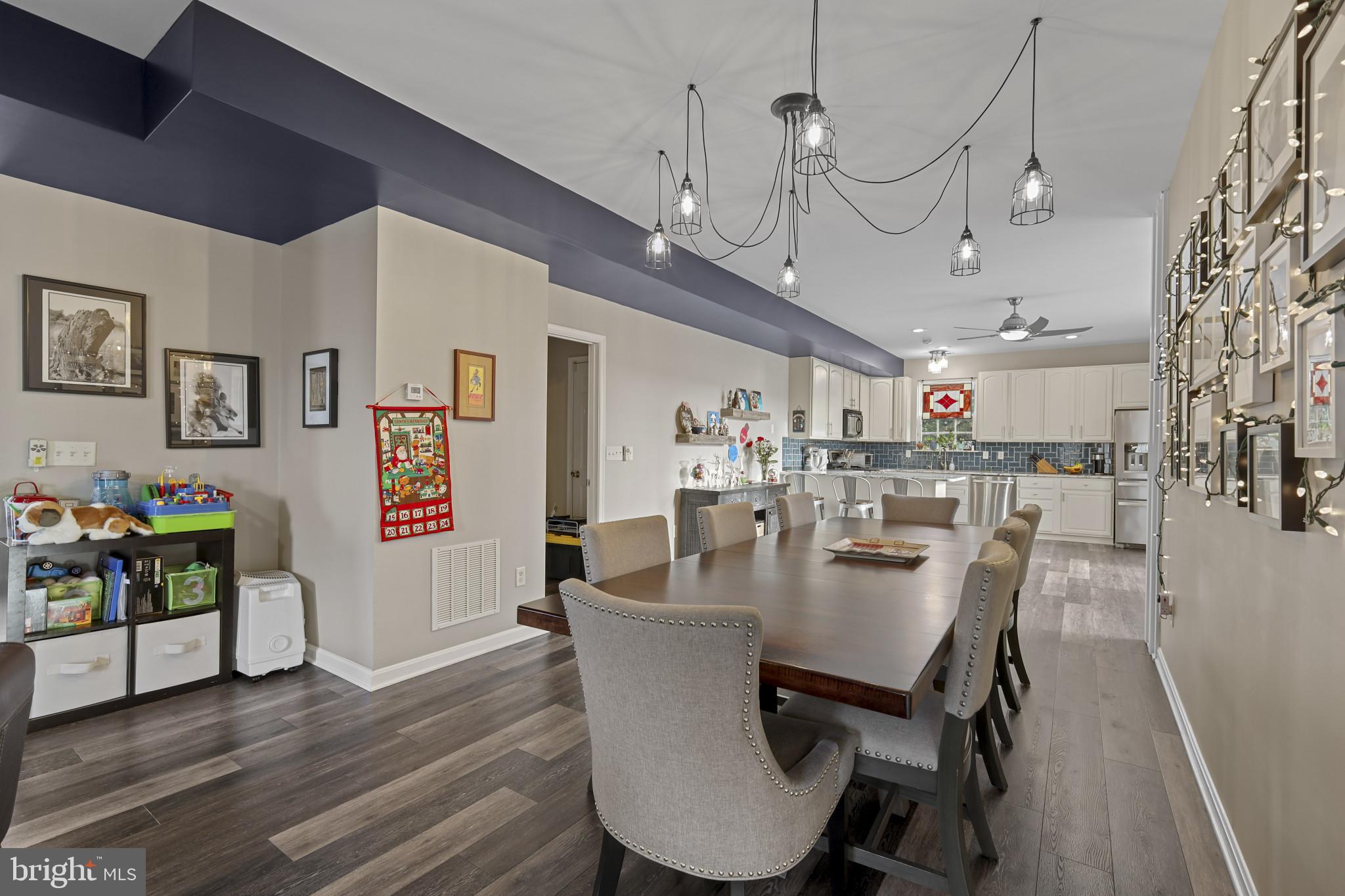 4220 Kings Road Edgewater, MD 21037 - Photo 19 of 78 a view of a dining room with furniture and wooden floor