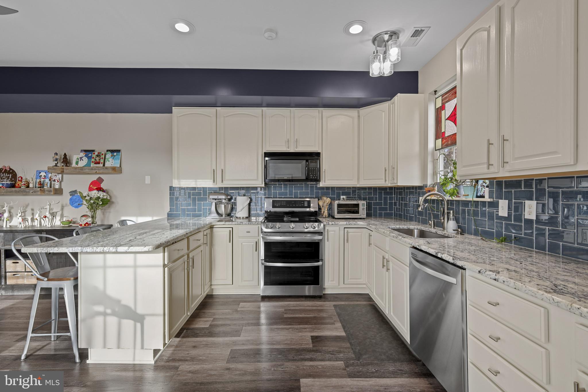 4220 Kings Road Edgewater, MD 21037 - Photo 23 of 78 a kitchen with granite countertop a sink and stainless steel appliances