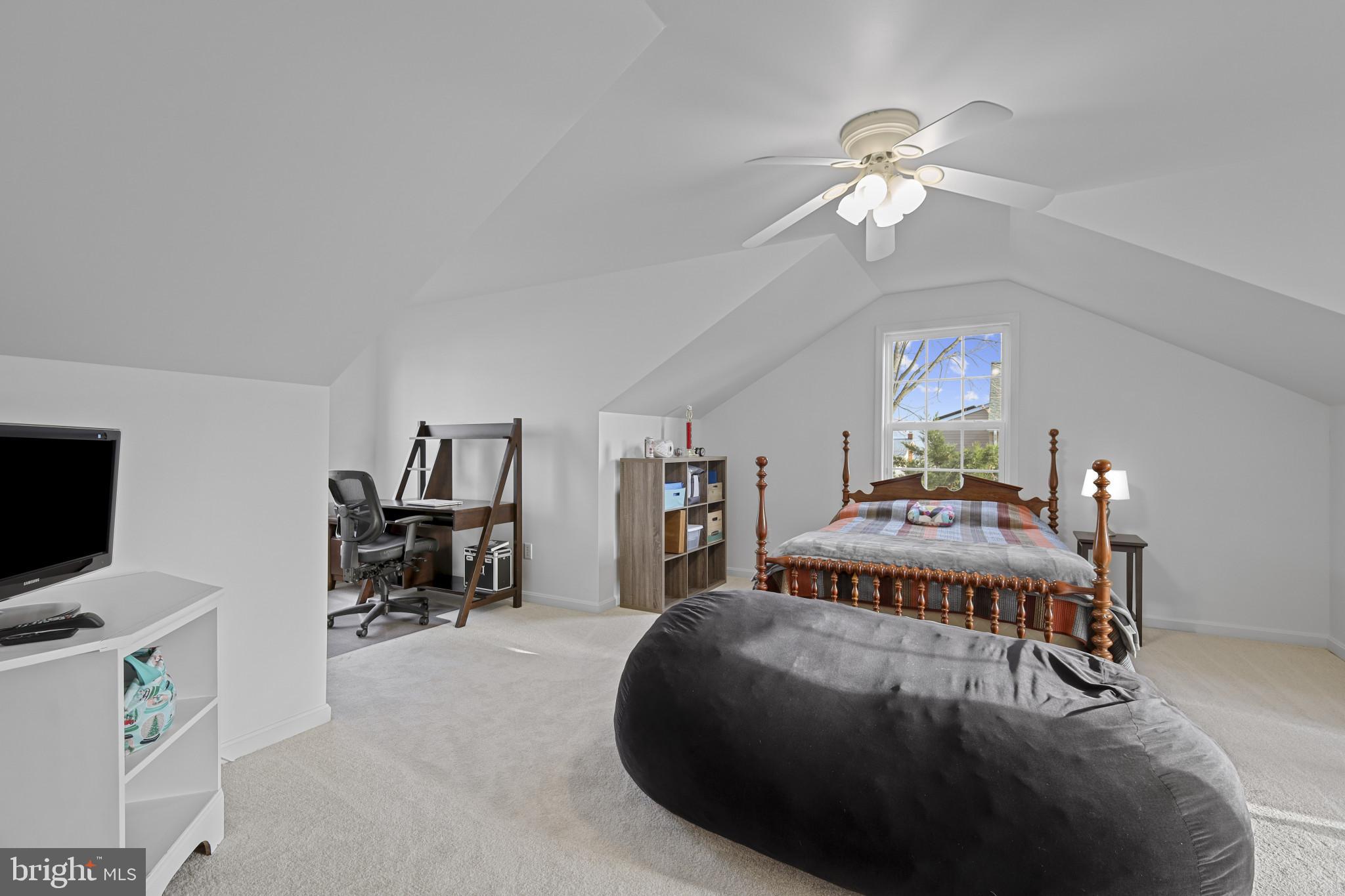 4220 Kings Road Edgewater, MD 21037 - Photo 29 of 78 a bedroom with a bed and a chandelier