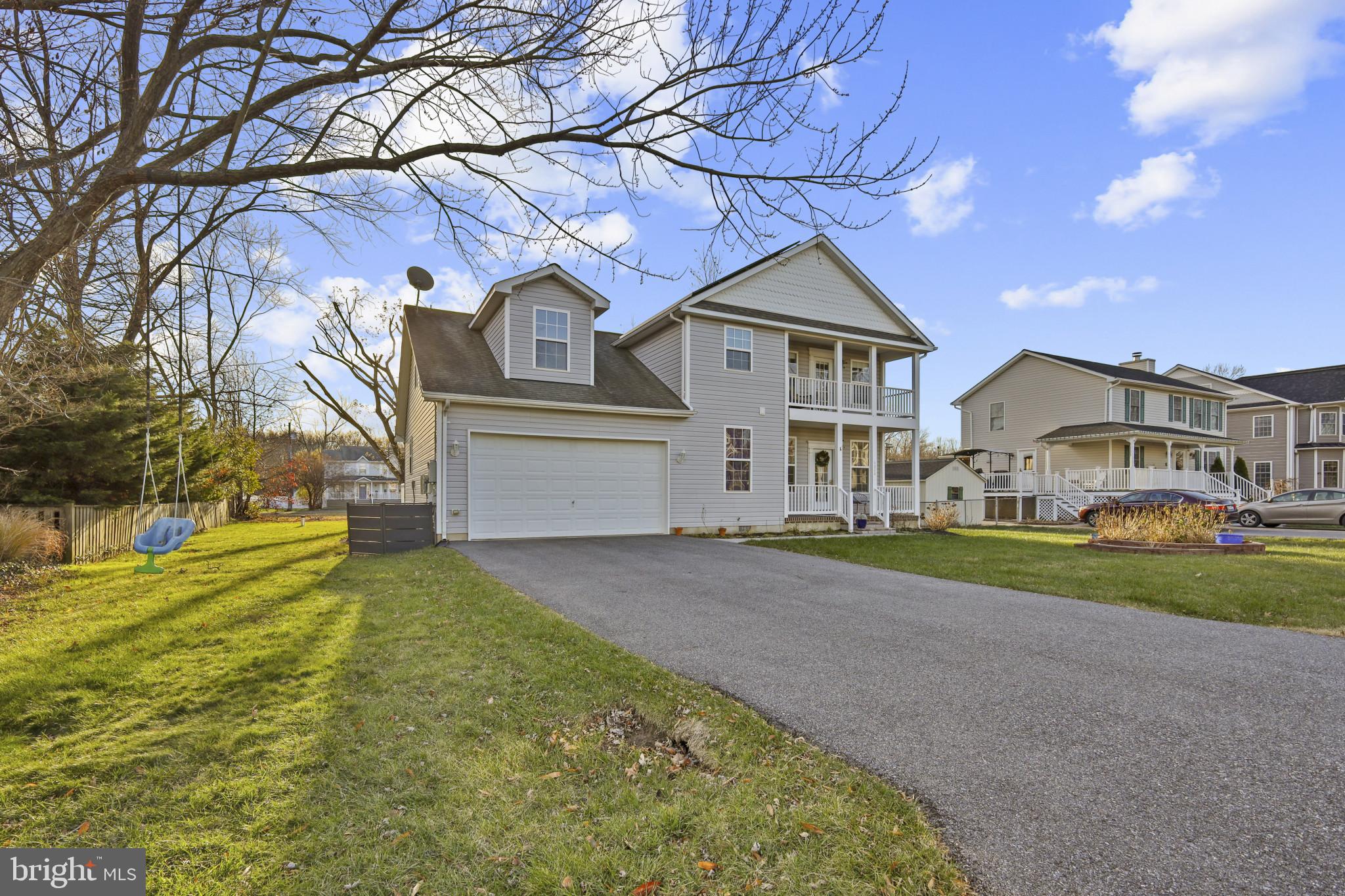 4220 Kings Road Edgewater, MD 21037 - Photo 3 of 78 a front view of a house with garden