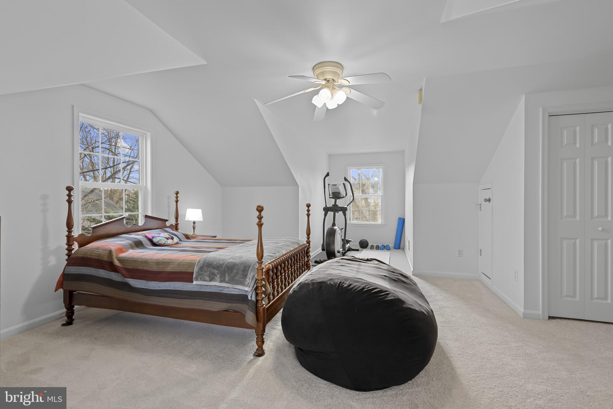 4220 Kings Road Edgewater, MD 21037 - Photo 31 of 78 a spacious bedroom with a bed and a chandelier