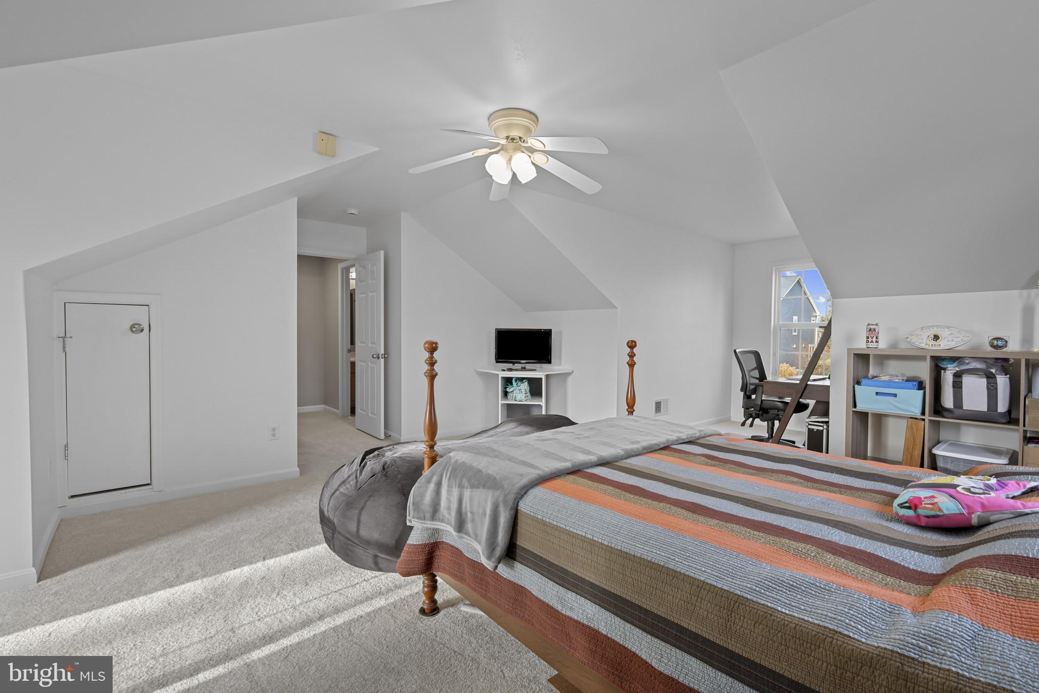 4220 Kings Road Edgewater, MD 21037 - Photo 32 of 78 a bedroom with bed and a chandelier