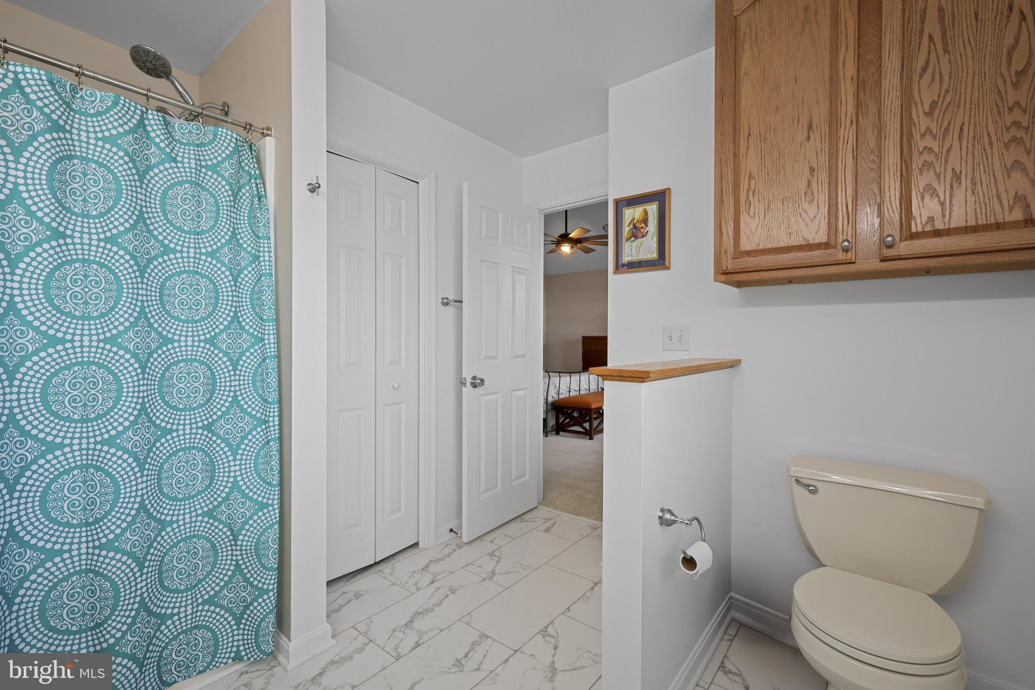 4220 Kings Road Edgewater, MD 21037 - Photo 39 of 78 a bathroom with a toilet and a shower