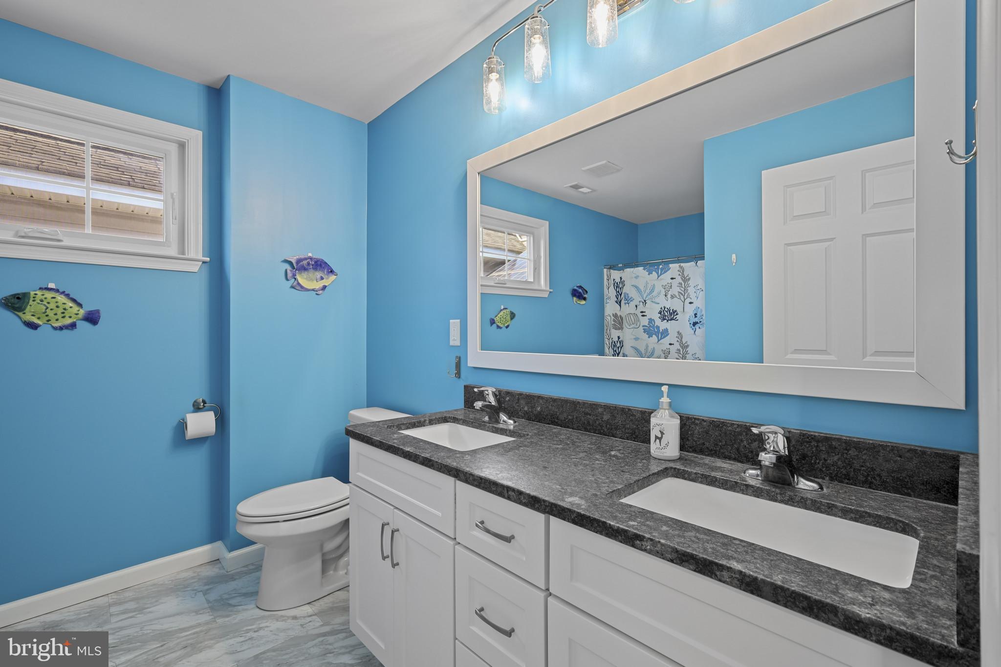 4220 Kings Road Edgewater, MD 21037 - Photo 42 of 78 a bathroom with a granite countertop sink mirror vanity and toilet