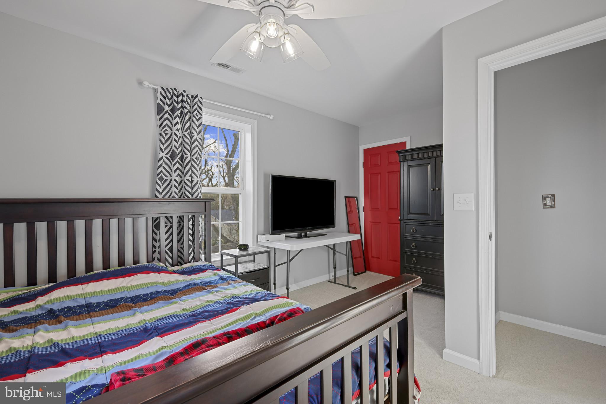 4220 Kings Road Edgewater, MD 21037 - Photo 50 of 78 a room with a bed and a flat screen tv