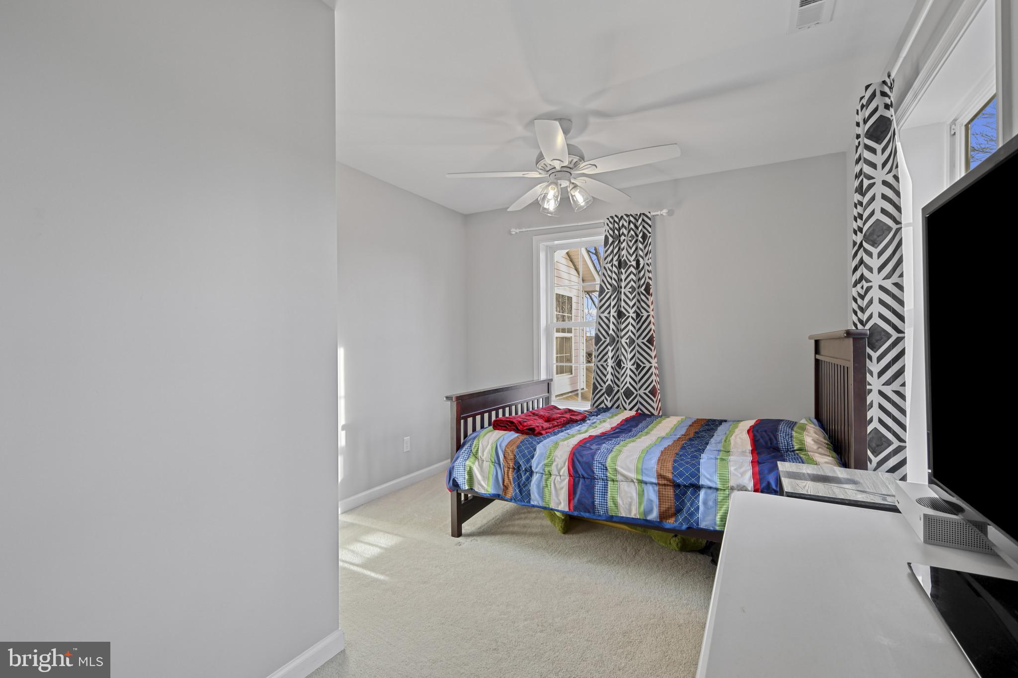 4220 Kings Road Edgewater, MD 21037 - Photo 51 of 78 a bedroom with a bed and a chandelier