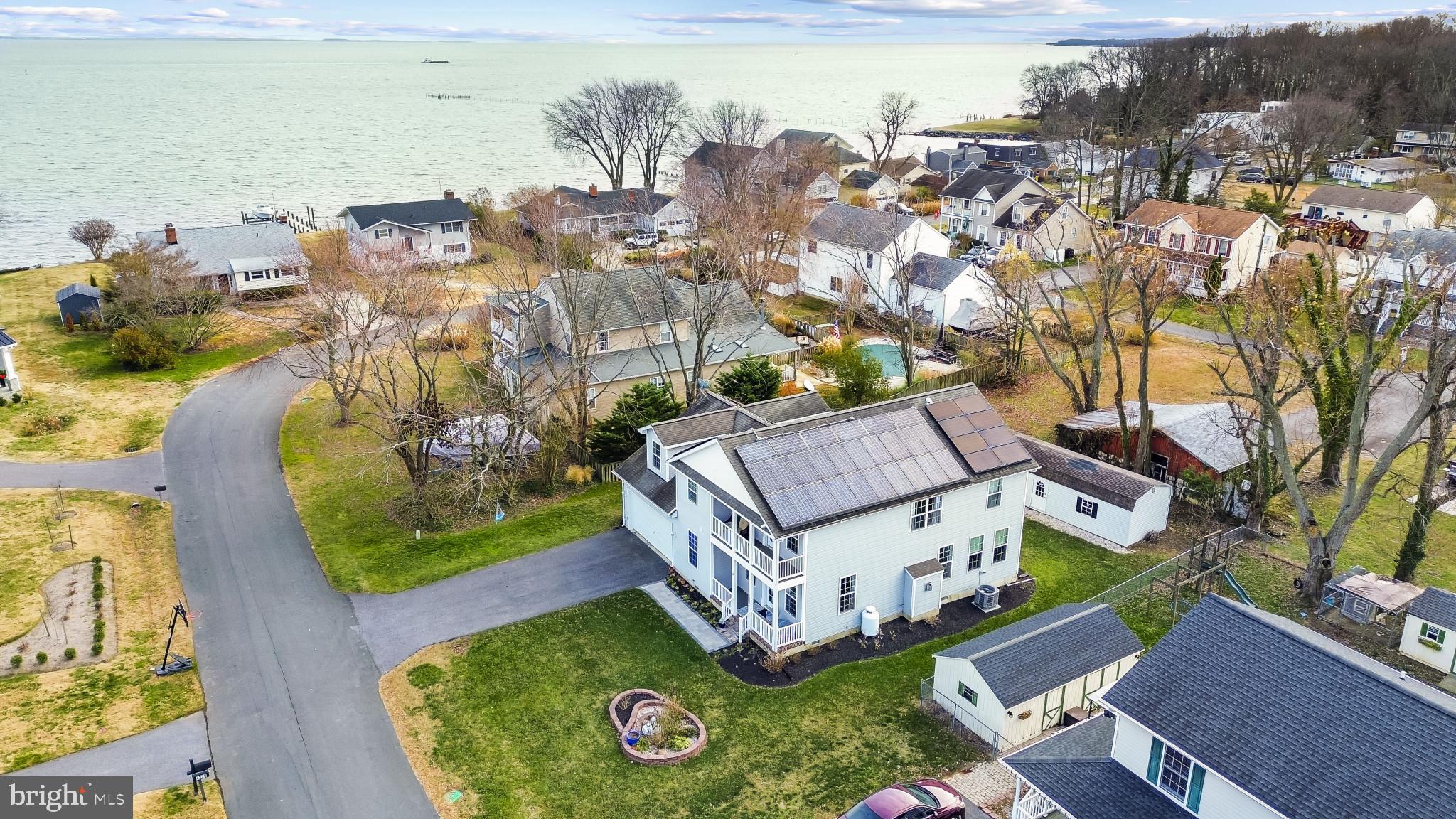 4220 Kings Road Edgewater, MD 21037 - Photo 60 of 78 an aerial view of a house with garden space and lake view