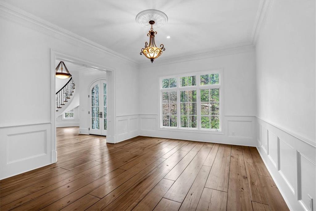 115 Mount Paran Ridge Atlanta, GA 30327 - Photo 12 of 85 wooden floor in an empty room with a window