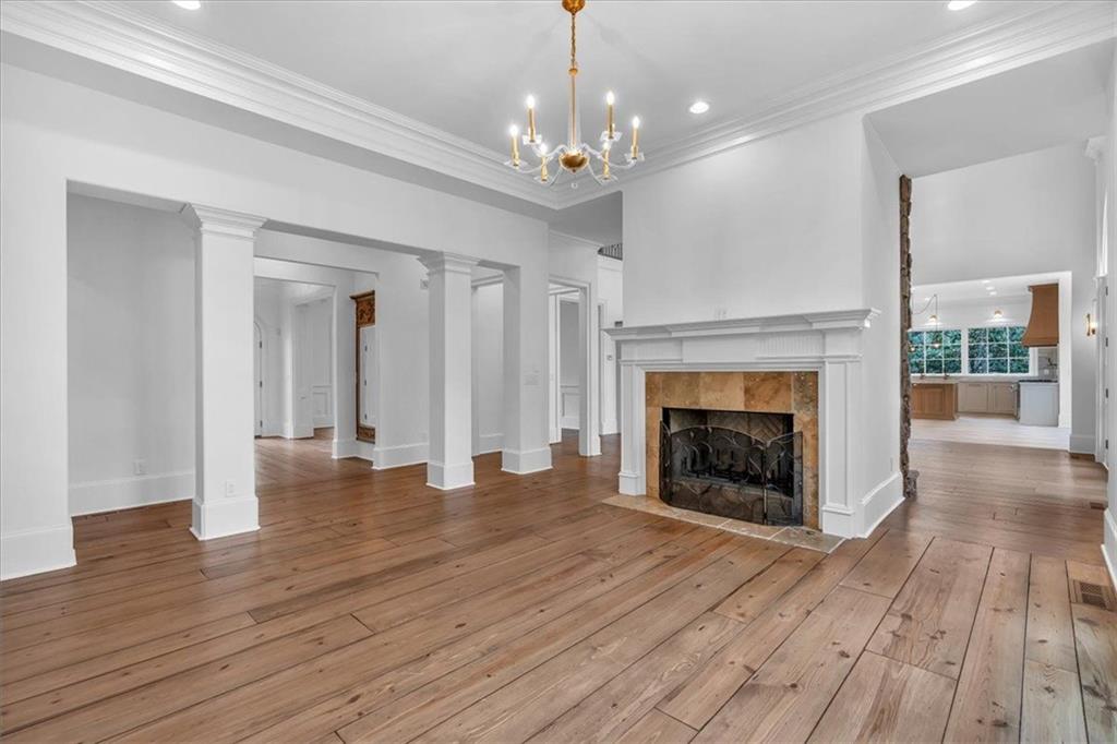 115 Mount Paran Ridge Atlanta, GA 30327 - Photo 14 of 85 wooden floor fireplace and windows in an empty room