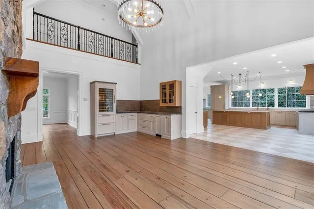 a kitchen with stainless steel appliances granite countertop a refrigerator and a stove