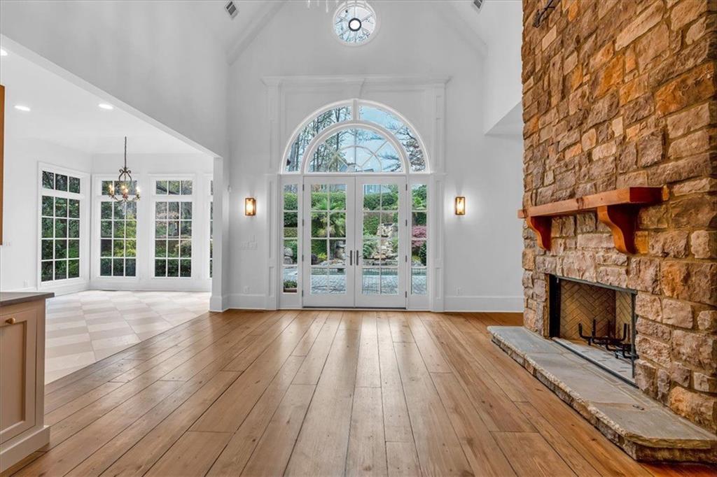 115 Mount Paran Ridge Atlanta, GA 30327 - Photo 18 of 85 a view of an empty room with wooden floor fireplace and a window