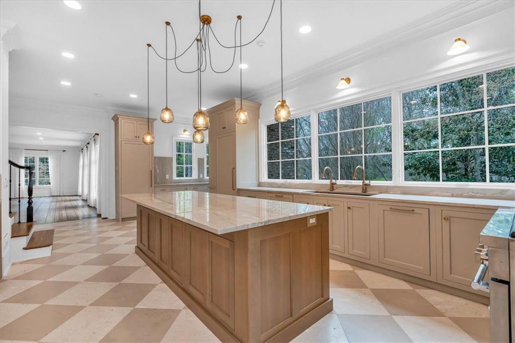 115 Mount Paran Ridge Atlanta, GA 30327 - Photo 24 of 85 a kitchen with granite countertop a sink a counter top space and stainless steel appliances