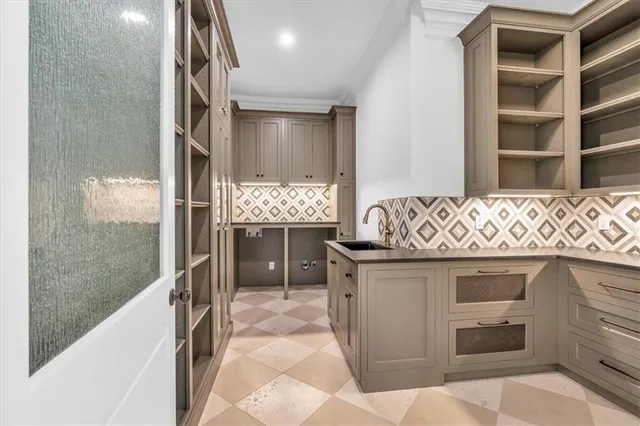 a bathroom with a granite countertop sink a toilet and a mirror