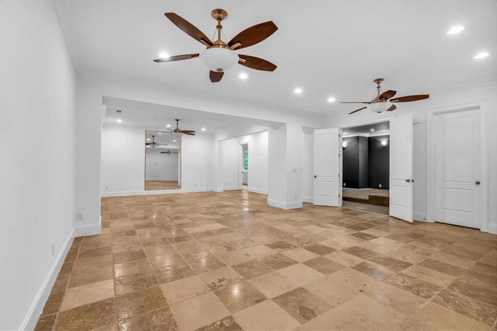 115 Mount Paran Ridge Atlanta, GA 30327 - Photo 37 of 85 a view of a big room with kitchen and chandelier fan
