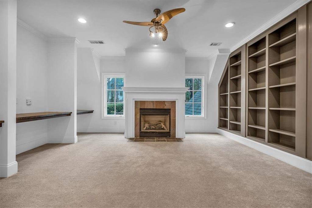 115 Mount Paran Ridge Atlanta, GA 30327 - Photo 57 of 85 a view of an empty room with a fireplace and a window