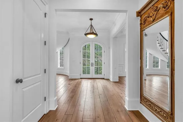 a view of an empty room with a fireplace and a window