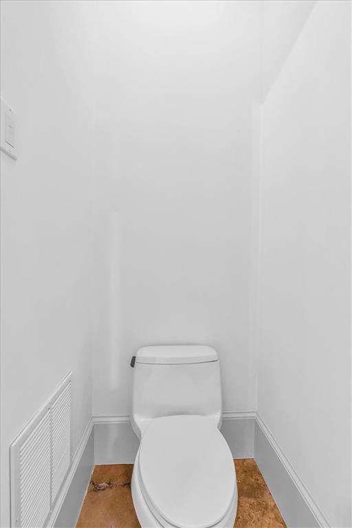 115 Mount Paran Ridge Atlanta, GA 30327 - Photo 66 of 85 a white toilet sitting next to a white wall