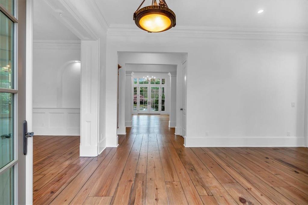 115 Mount Paran Ridge Atlanta, GA 30327 - Photo 7 of 85 wooden floor in an empty room with a window