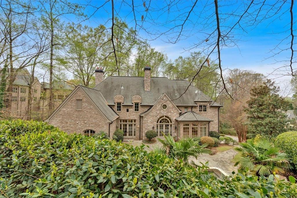 115 Mount Paran Ridge Atlanta, GA 30327 - Photo 75 of 85 a view of a house with a yard and sitting area