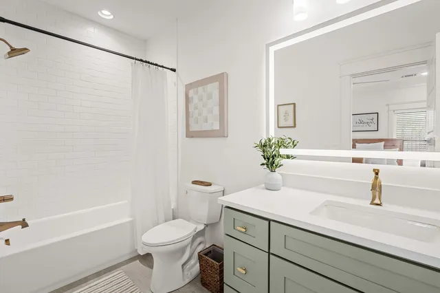 a bathroom with a sink a toilet and a bathtub