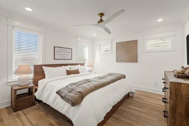 a bedroom with bed and window