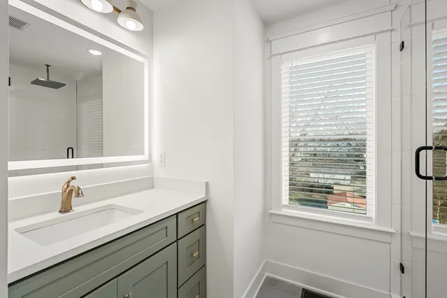a bathroom with a sink and a mirror