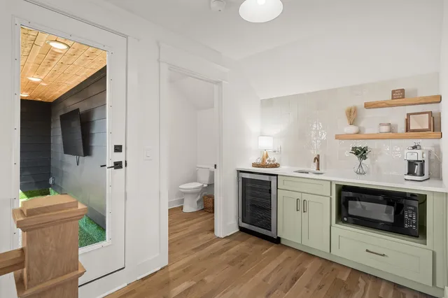 a kitchen with stainless steel appliances a stove a sink and a refrigerator