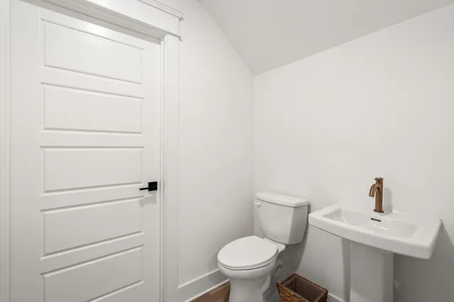 a bathroom with a toilet and a sink